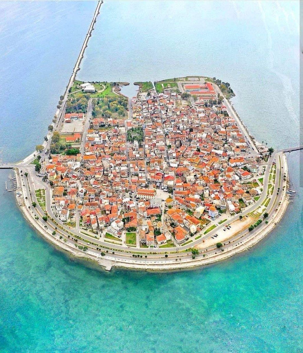 Aerial photo of a slightly larger island completely covered in densely packed buildings